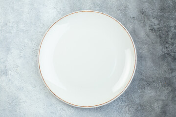 Empty plate on half dark light gray background with distressed coarse-grained gradient surface