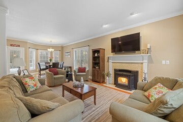 Inviting living room featuring cozy seating and stylish tables, perfect for entertaining guests