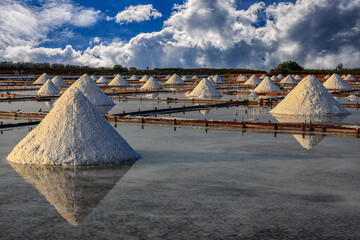 The salt field with a long and moving history,conical salt pile,scenic sky...