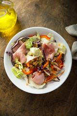 Leaf salad with ham and mustard