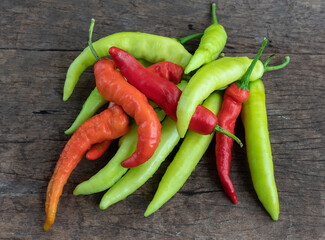 fresh green sweet peppers garden pepper, banana peppers, on a wood background
