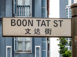 Road sign in English and Chinese for Boon Tat Street in downtown Singapore