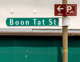 Green road sign in downtown Singapore