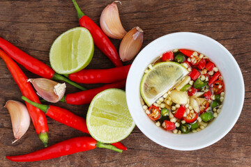 Red hot chili peppers and garlic, lime,Dipping food Thailand on wooden background