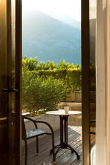 Beautiful view on terrace - mountains at sunlight, relaxation vacation concept