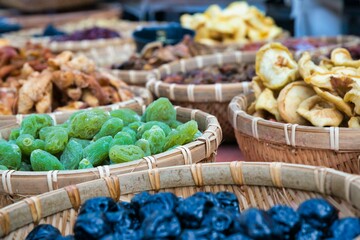 Great variety of dried fruits in wicker bowls.