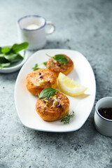 Traditional homemade fish cakes with lemon