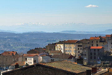 Aerial view of dense historic center of Thiers town in Puy-de-Dome department, Auvergne-Rhone-Alpes region in France. Rooftops of old buildings and narrow streets