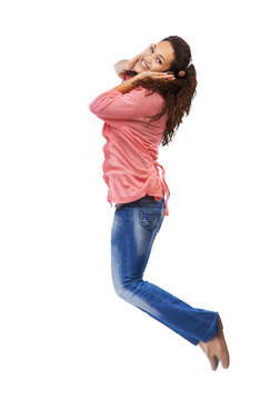 Music, headphones and portrait of woman jump on isolated, transparent and png background. Radio, jumping and face of happy girl excited for podcast, track or streaming subscription, fun and free