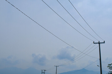 Landscape Photography. Photo of electric poles with clear sky in the afternoon in Bandung City - Indonesia