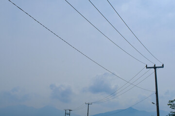 Landscape Photography. Photo of electric poles with clear sky in the afternoon in Bandung City -...