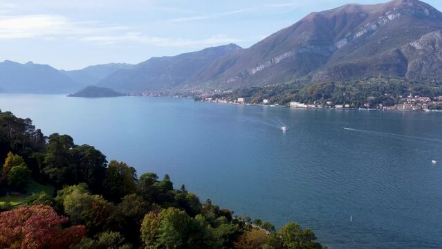 Drone view over the Como lake surrounded by mountains in Bellagio, Italy