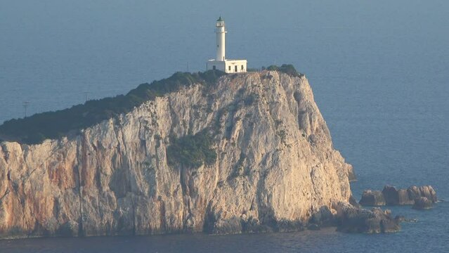Zoom in the lighthouse on the top of Ducato cliff, Lefkada island in Greece, zoom in