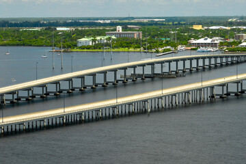 Barron Collier Bridge and Gilchrist Bridge in Florida with moving traffic. Transportation...