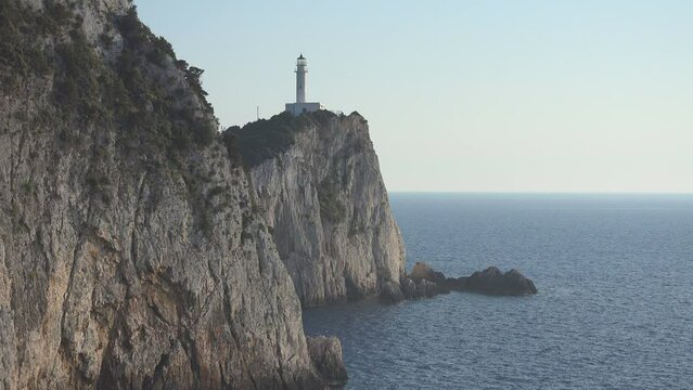 Lighthouse on the steep cliff of Ducato Cape in Lefkada Island