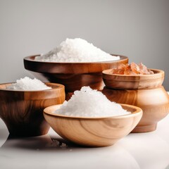 Several types of salt in wooden bowls on the table. Himalayan, Hawaiian, table, sea salt. Generative AI