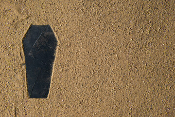 black coffin shape made on the sand death funeral israel palestine war warrior