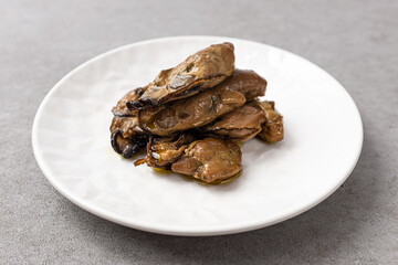 Smoked oysters smoked and marinated in olive oil
