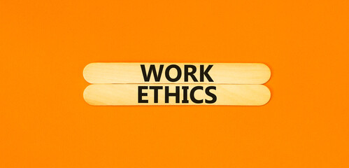 Work ethics symbol. Concept words Work ethics on beautiful wooden stick. Beautiful orange table...