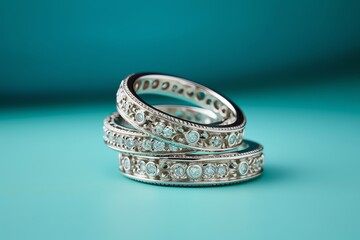 Three Diamond Eternity Rings On Turquoise Background. Generative AI