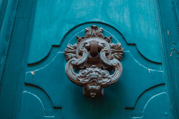 Door knocker made of brass on a front door