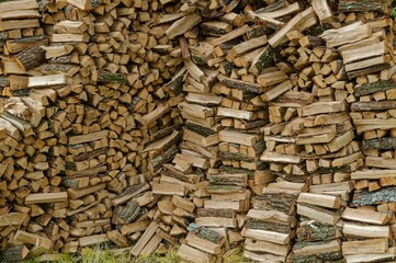 Pile of cut firewood arranged neatly