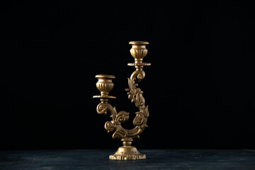 Fototapeta na wymiar front view elegant candlestick on dark background gold lamp lighting fire