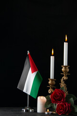front view of burning candles with palestinian flag on dark background death israel funeral