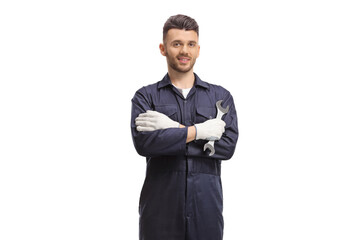 Car mechanic holding a wrench and posing