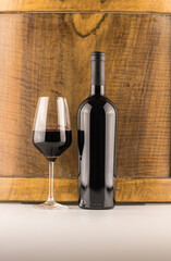 bottle of red wine and glass