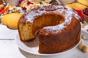 Traditional Festa Junina Summer Festival Carnival Food. Traditional Brazilian Festa Junina dishes and snacks - popcorn, peanuts, corn cake and cookie, pacoca, with holiday decorations and accessories