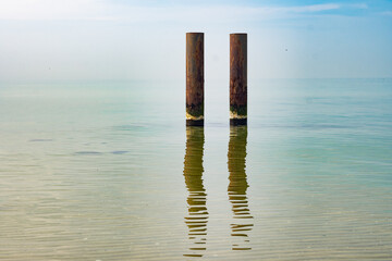 pillars in the water and reflection
