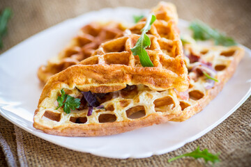 Egg omelette stuffed with onions and herbs, fried in the form of waffles