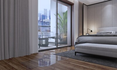 Water flooded on wood parquet floor in bedroom