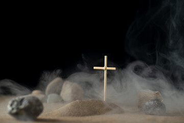 front view of little grave with stones on sand palestine death war
