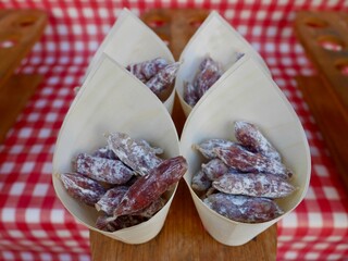 Cones filled with French sausages at local farmer's market in Aix-en-Provence, Provence, France.