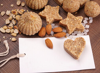 Homemade healthy and sweet groundnut or peanut and Jaggery Laddoo, delicious indian sweet served on a wooden background.Roasted peanut isolated.