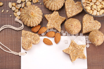 Homemade healthy and sweet groundnut or peanut and Jaggery Laddoo, delicious indian sweet served on a wooden background.Roasted peanut isolated.