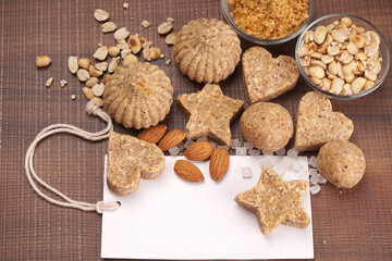 Homemade healthy and sweet groundnut or peanut and Jaggery Laddoo, delicious indian sweet served on a wooden background.Roasted peanut isolated.