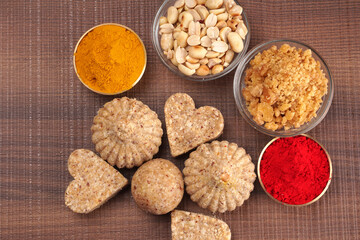 Homemade healthy and sweet groundnut or peanut and Jaggery Laddoo, delicious indian sweet served on a wooden background.Roasted peanut isolated.