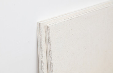 Drywall sheets on a white wall. Background.