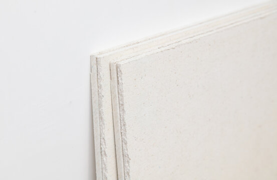 Drywall sheets on a white wall. Background.