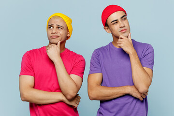 Young minded pensive cheerful smiling happy fun couple two friends men wearing casual clothes...