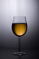 Glass of white wine on  white background