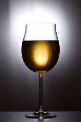 Glass of white wine on  white background