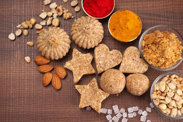 Homemade healthy and sweet groundnut or peanut and Jaggery Laddoo, delicious indian sweet served on a wooden background.Roasted peanut isolated.