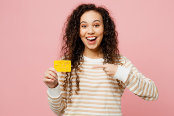 Young shocked happy woman of African American ethnicity she wear light casual clothes hold in hand...