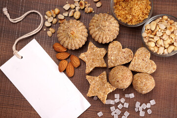 Homemade healthy and sweet groundnut or peanut and Jaggery Laddoo, delicious indian sweet served on a wooden background.Roasted peanut isolated.