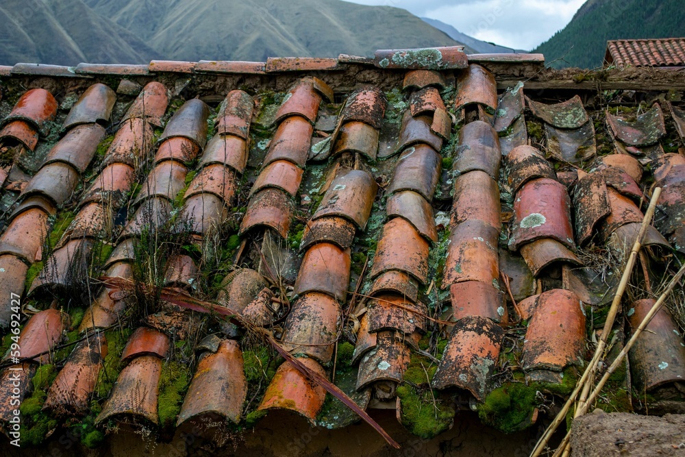 Sticker Old tiled roof of an abandoned house.