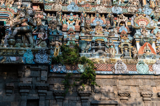Beautiful colorful carvings of Hindu Gods and deities on the gopuram tower of the ancient Nataraja temple.